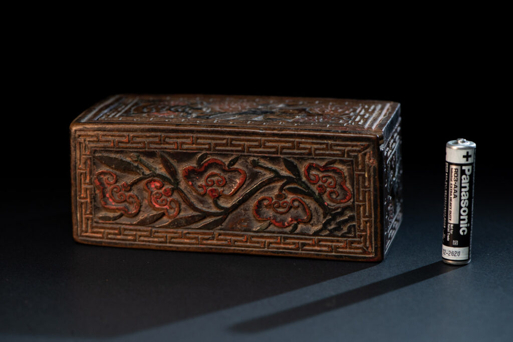 Ancient Pingpu Tribes wooden box with a sliding lid carved with the typical Pingpu tribe flower pattern and paint with red and black pigments.