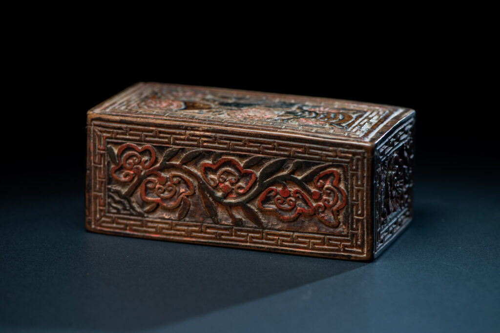 Ancient Pingpu Tribes wooden box with a sliding lid carved with the typical Pingpu tribe flower pattern and paint with red and black pigments.