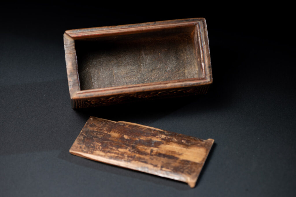 Ancient Pingpu Tribes wooden box with a sliding lid carved with the typical Pingpu tribe flower pattern and paint with red and black pigments.