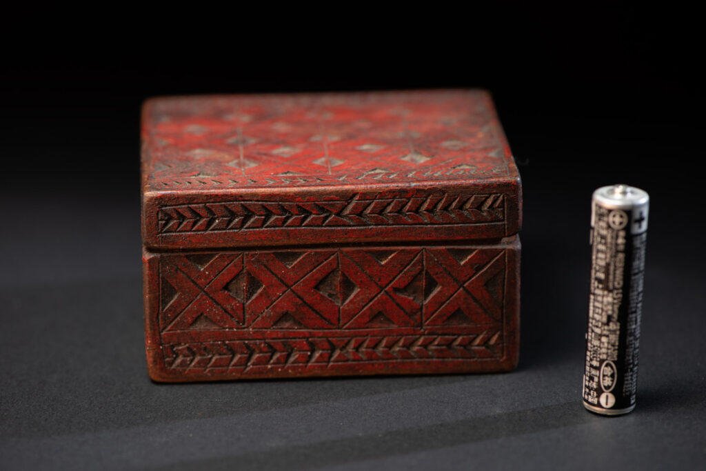 Paiwan tribe wooden Box paint with red pigments with geometrical patterns.