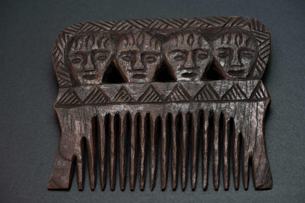 Paiwan tribe wooden Comb carved with four human faces