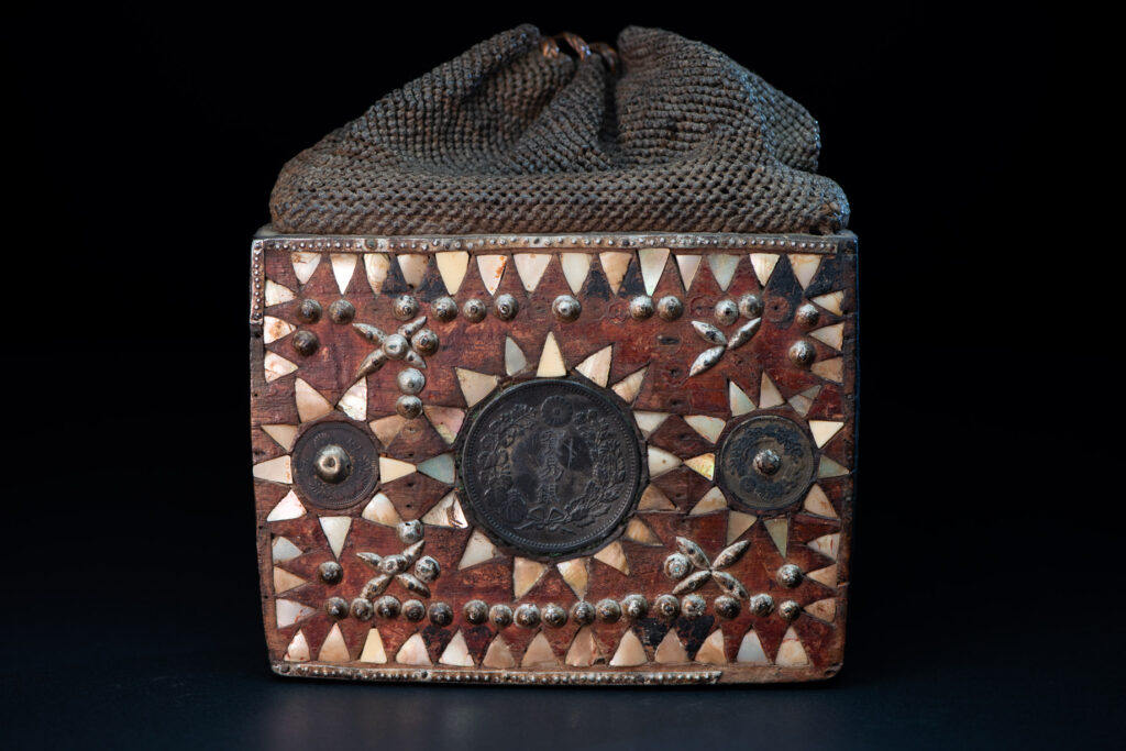 Old shaman’s box – Puyuma tribe – inlaid with mother-of-pearl in triangular patterns, reflecting the distinctive style of the Puyuma tribes. The box is also decorated with embedded old coins.