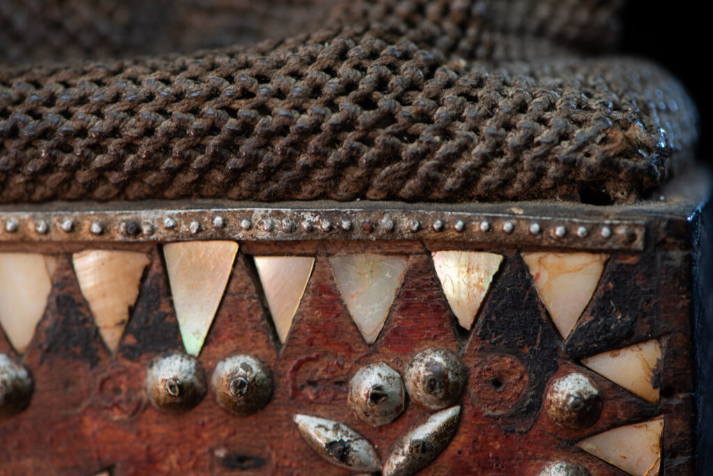 Old shaman’s box – Puyuma tribe – inlaid with mother-of-pearl in triangular patterns, reflecting the distinctive style of the Puyuma tribes. The box is also decorated with embedded old coins.
