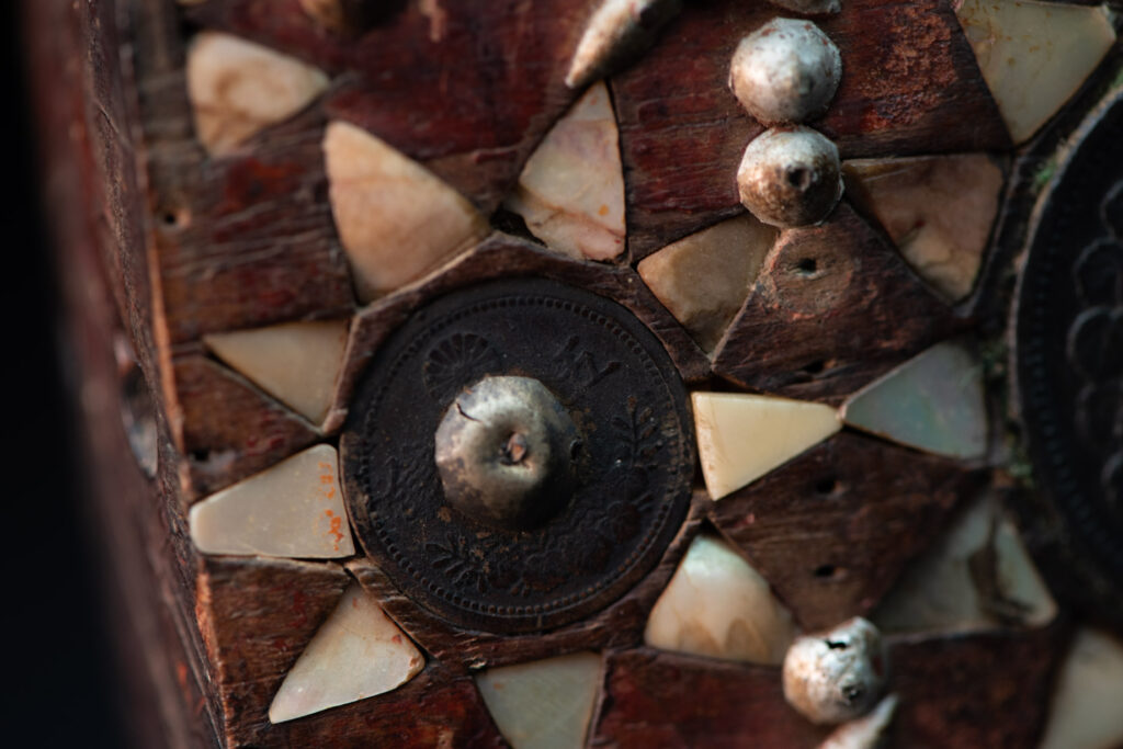Old shaman’s box – Puyuma tribe – inlaid with mother-of-pearl in triangular patterns, reflecting the distinctive style of the Puyuma tribes. The box is also decorated with embedded old coins.