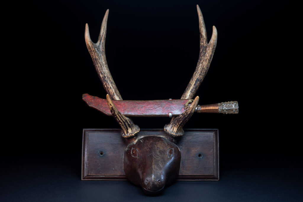 Rukai tribe short knife worn in complement of the sword . sheath red painted