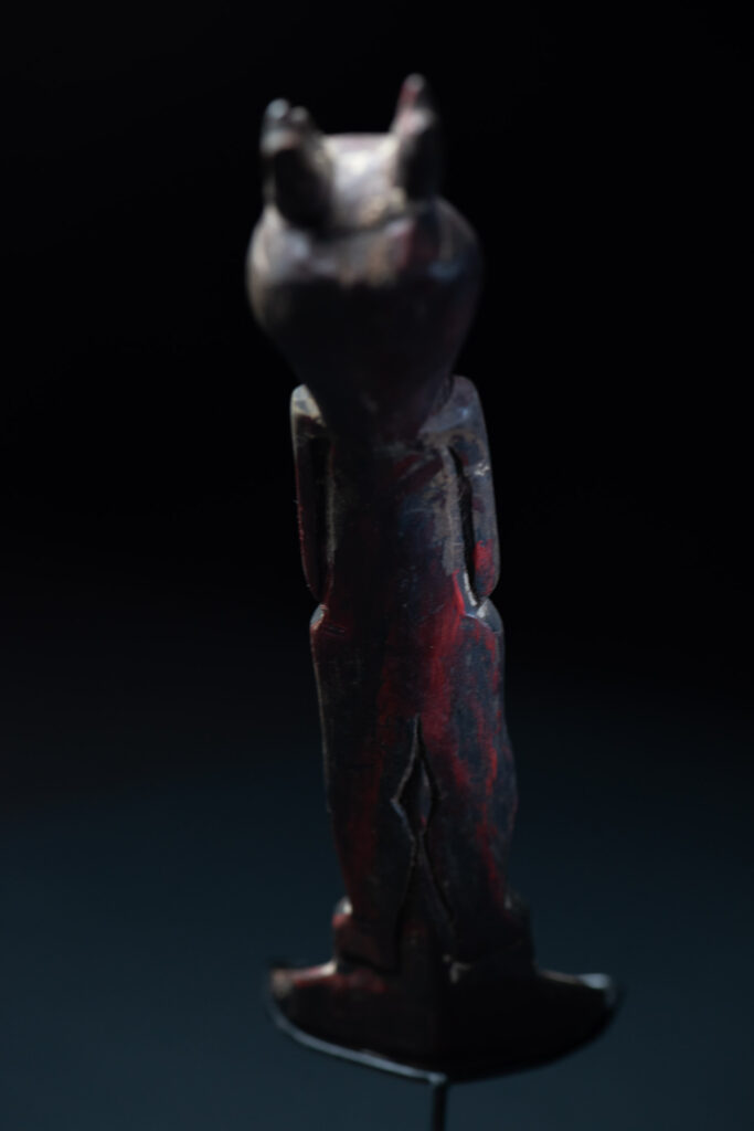 Old spoon from the Paiwan tribe, tinted with red pigments and depicting an ancestor wearing a ceremonial headdress.