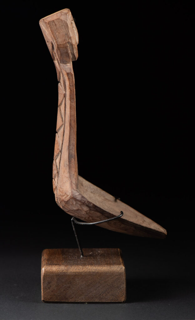 Old wooden spoon from the Paiwan tribe, carved with a one hundred pace snake at the back and one human head and sacred snake at the front.