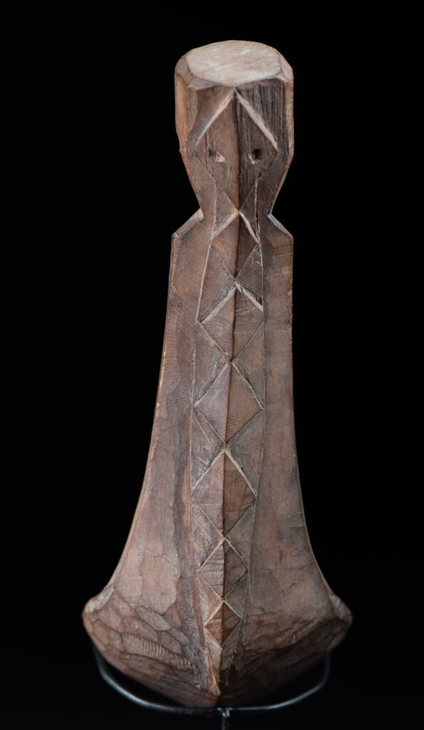 Old wooden spoon from the Paiwan tribe, carved with a one hundred pace snake at the back and one human head and sacred snake at the front.