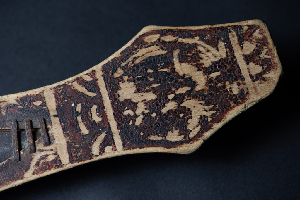 Sword of the Pingpu tribes (plains aborigines), featuring typical Pingpu style: floral painted design on the back of the scabbard; sword hilt forged in one piece with the blade, without separate assembly and attayal tribe influence on design.