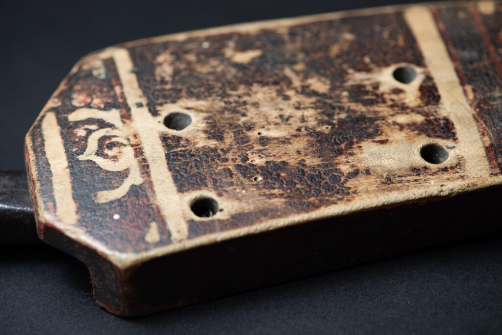 Sword of the Pingpu tribes (plains aborigines), featuring typical Pingpu style: floral painted design on the back of the scabbard; sword hilt forged in one piece with the blade, without separate assembly and attayal tribe influence on design.