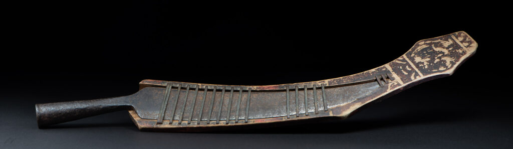 Sword of the Pingpu tribes (plains aborigines), featuring typical Pingpu style: floral painted design on the back of the scabbard; sword hilt forged in one piece with the blade, without separate assembly and attayal tribe influence on design.
