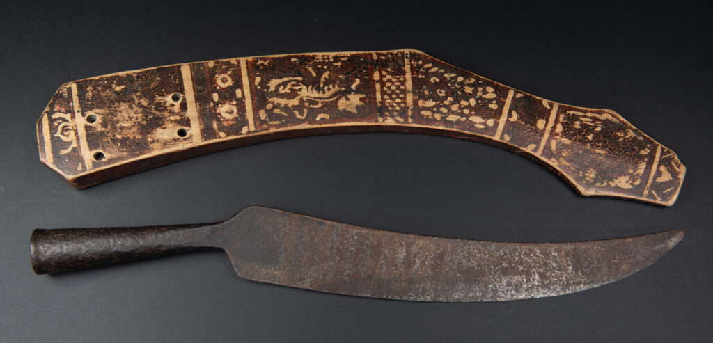 Sword of the Pingpu tribes (plains aborigines), featuring typical Pingpu style: floral painted design on the back of the scabbard; sword hilt forged in one piece with the blade, without separate assembly and attayal tribe influence on design.
