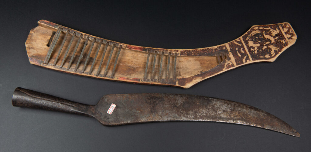 Sword of the Pingpu tribes (plains aborigines), featuring typical Pingpu style: floral painted design on the back of the scabbard; sword hilt forged in one piece with the blade, without separate assembly and attayal tribe influence on design.