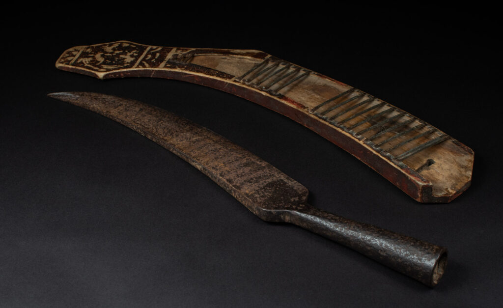 Sword of the Pingpu tribes (plains aborigines), featuring typical Pingpu style: floral painted design on the back of the scabbard; sword hilt forged in one piece with the blade, without separate assembly and attayal tribe influence on design.