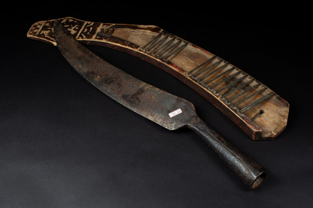 Sword of the Pingpu tribes (plains aborigines), featuring typical Pingpu style: floral painted design on the back of the scabbard; sword hilt forged in one piece with the blade, without separate assembly and attayal tribe influence on design.