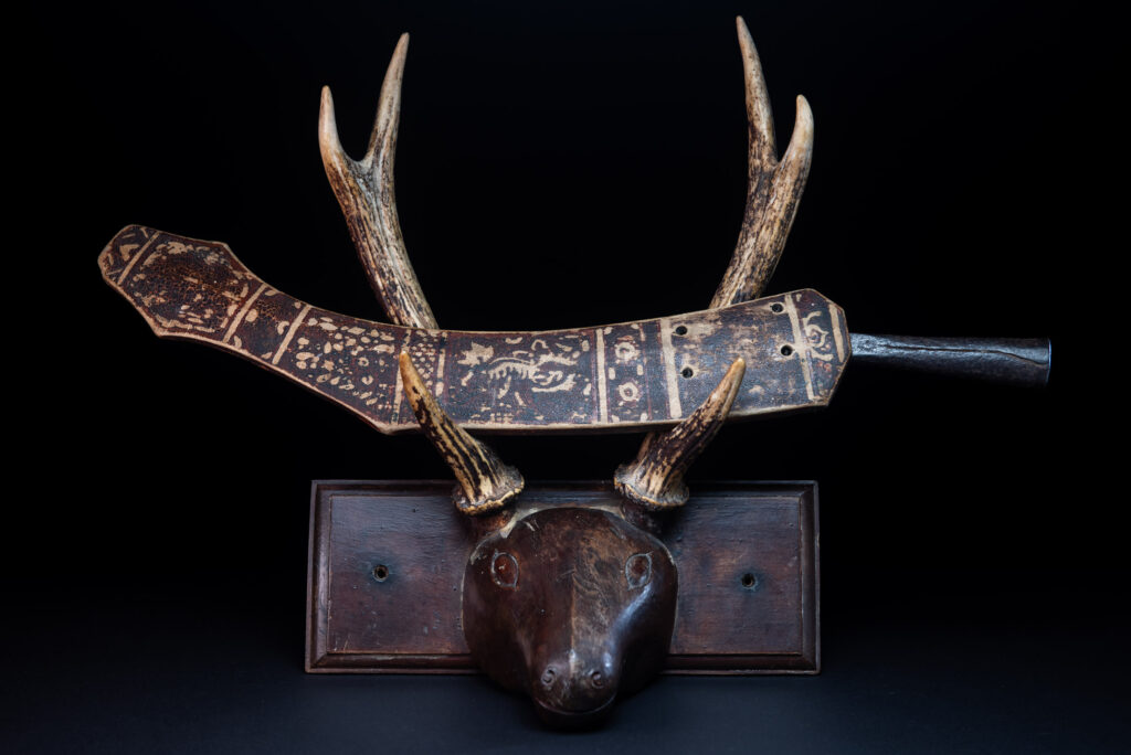 Sword of the Pingpu tribes (plains aborigines), featuring typical Pingpu style: floral painted design on the back of the scabbard; sword hilt forged in one piece with the blade, without separate assembly and attayal tribe influence on design.