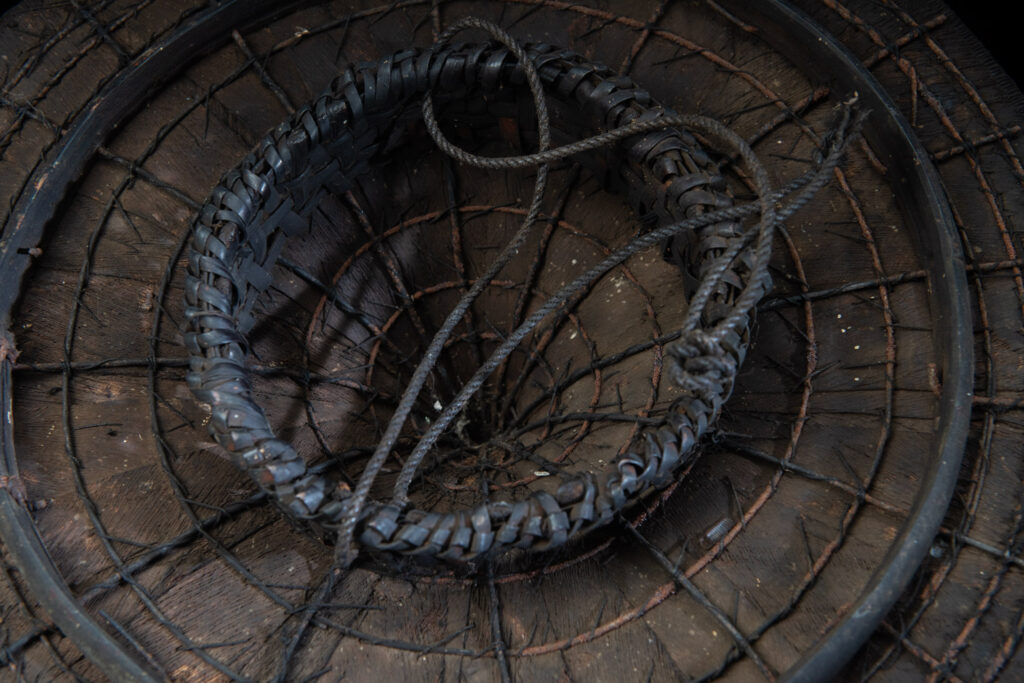 This ancient hat from the Yami- Tao tribes, orchid Island, Taiwan was worn by the female for work in the fields It is named “Varogot”. It is done with coconut palm bark, rotaing, aluminium and feathers for the top decoration..
