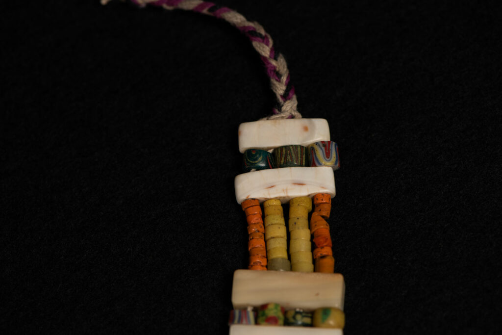 Paiwan tribe old Glass beads collar In Paiwan society, ancient and valuable glass beads are treasured as heirlooms or betrothal gifts, symbolizing aristocratic status. These beads are often carefully stored in old pottery jars.