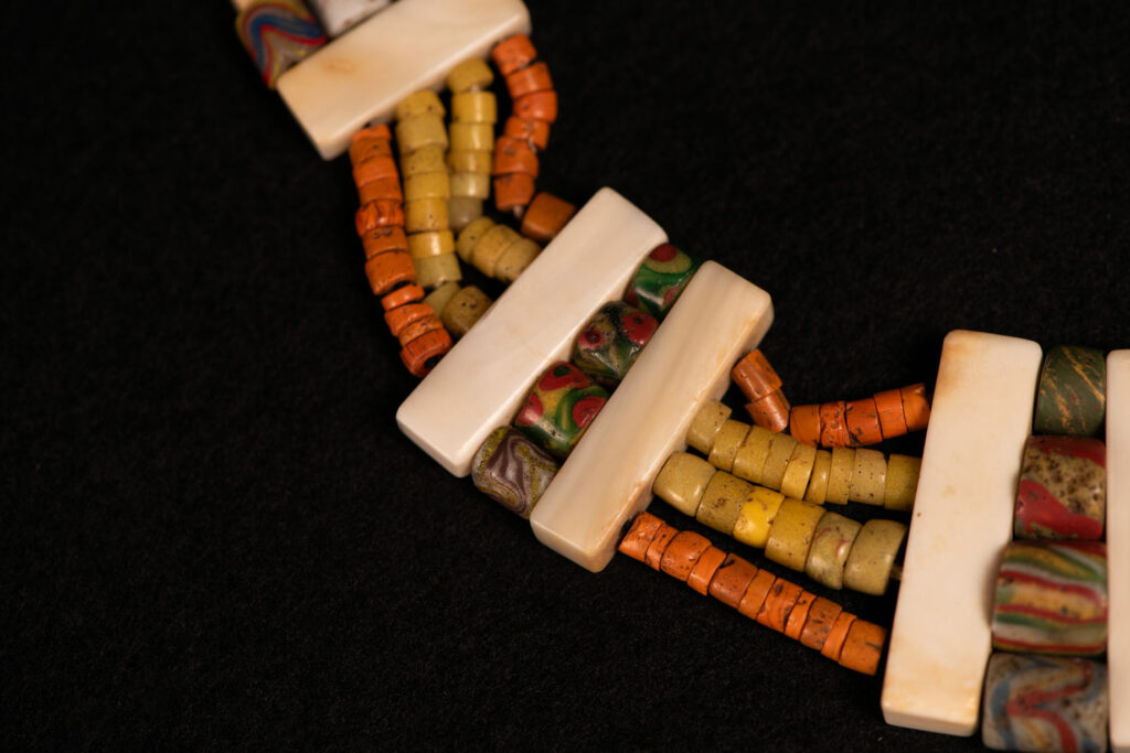 Paiwan tribe old Glass beads collar In Paiwan society, ancient and valuable glass beads are treasured as heirlooms or betrothal gifts, symbolizing aristocratic status. These beads are often carefully stored in old pottery jars.