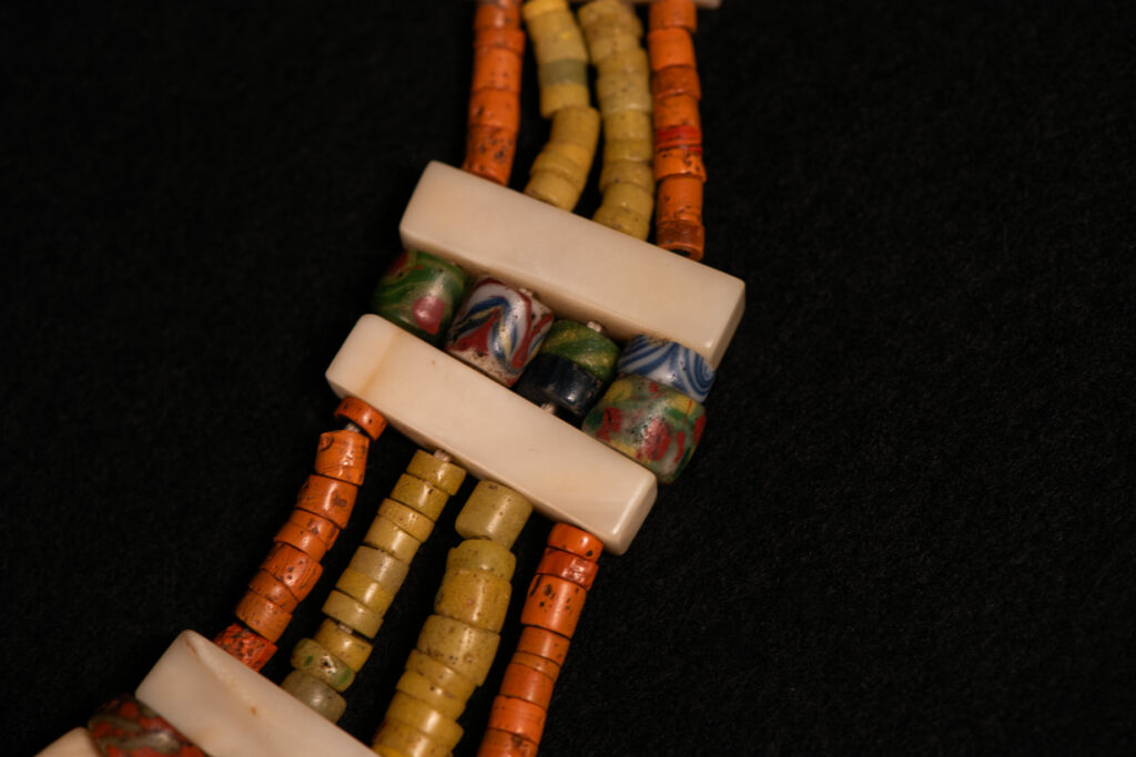 Paiwan tribe old Glass beads collar In Paiwan society, ancient and valuable glass beads are treasured as heirlooms or betrothal gifts, symbolizing aristocratic status. These beads are often carefully stored in old pottery jars.