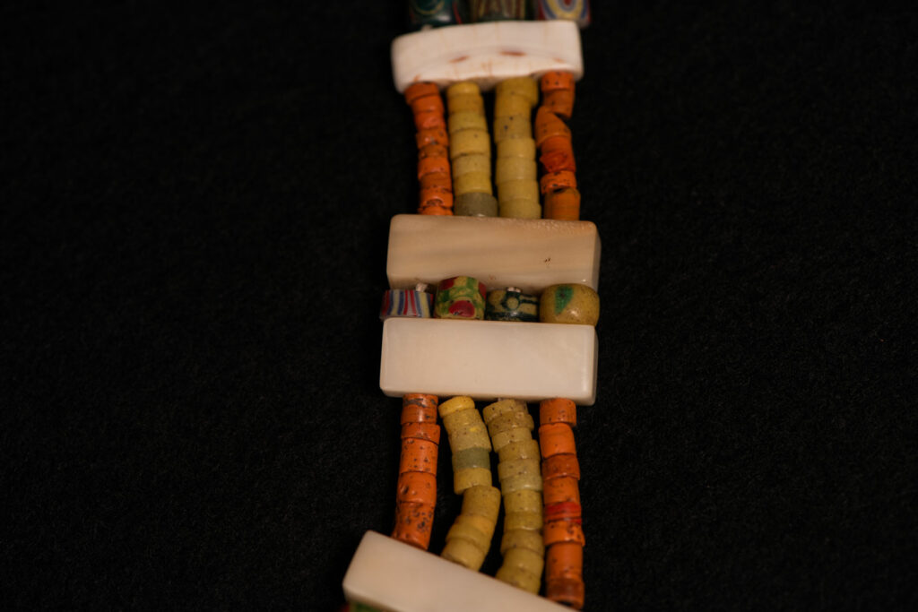 Paiwan tribe old Glass beads collar In Paiwan society, ancient and valuable glass beads are treasured as heirlooms or betrothal gifts, symbolizing aristocratic status. These beads are often carefully stored in old pottery jars.