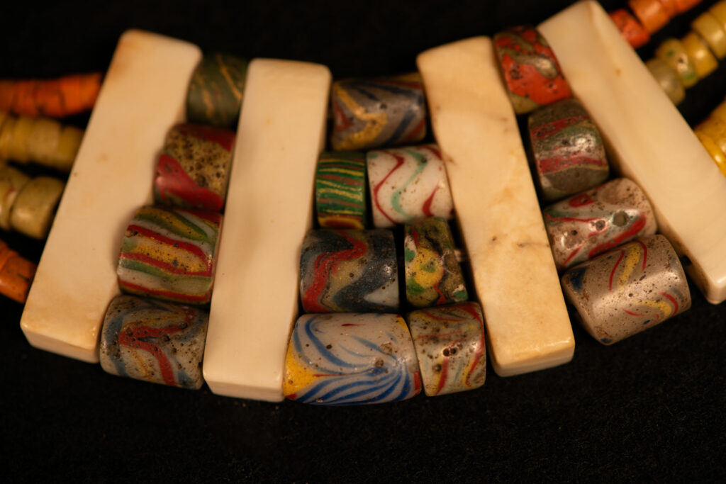 Paiwan tribe old Glass beads collar In Paiwan society, ancient and valuable glass beads are treasured as heirlooms or betrothal gifts, symbolizing aristocratic status. These beads are often carefully stored in old pottery jars.