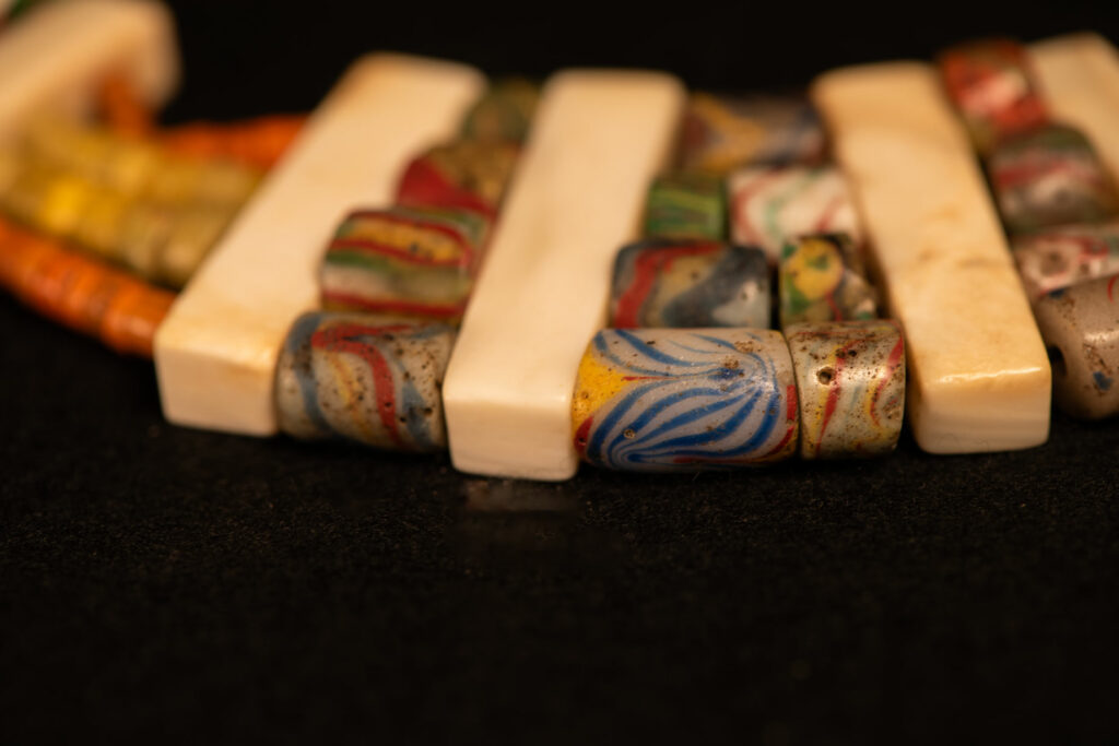 Paiwan tribe old Glass beads collar In Paiwan society, ancient and valuable glass beads are treasured as heirlooms or betrothal gifts, symbolizing aristocratic status. These beads are often carefully stored in old pottery jars.