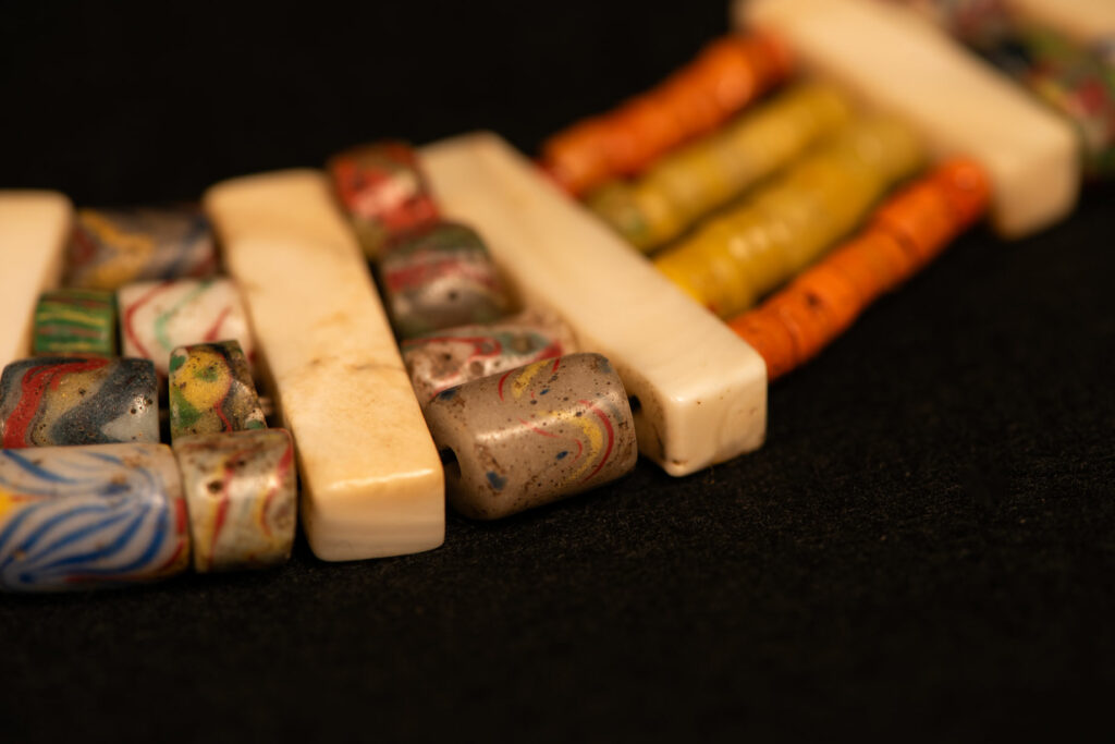 Paiwan tribe old Glass beads collar In Paiwan society, ancient and valuable glass beads are treasured as heirlooms or betrothal gifts, symbolizing aristocratic status. These beads are often carefully stored in old pottery jars.