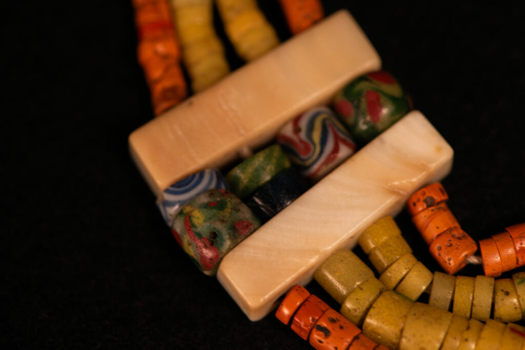 Paiwan tribe old Glass beads collar In Paiwan society, ancient and valuable glass beads are treasured as heirlooms or betrothal gifts, symbolizing aristocratic status. These beads are often carefully stored in old pottery jars.