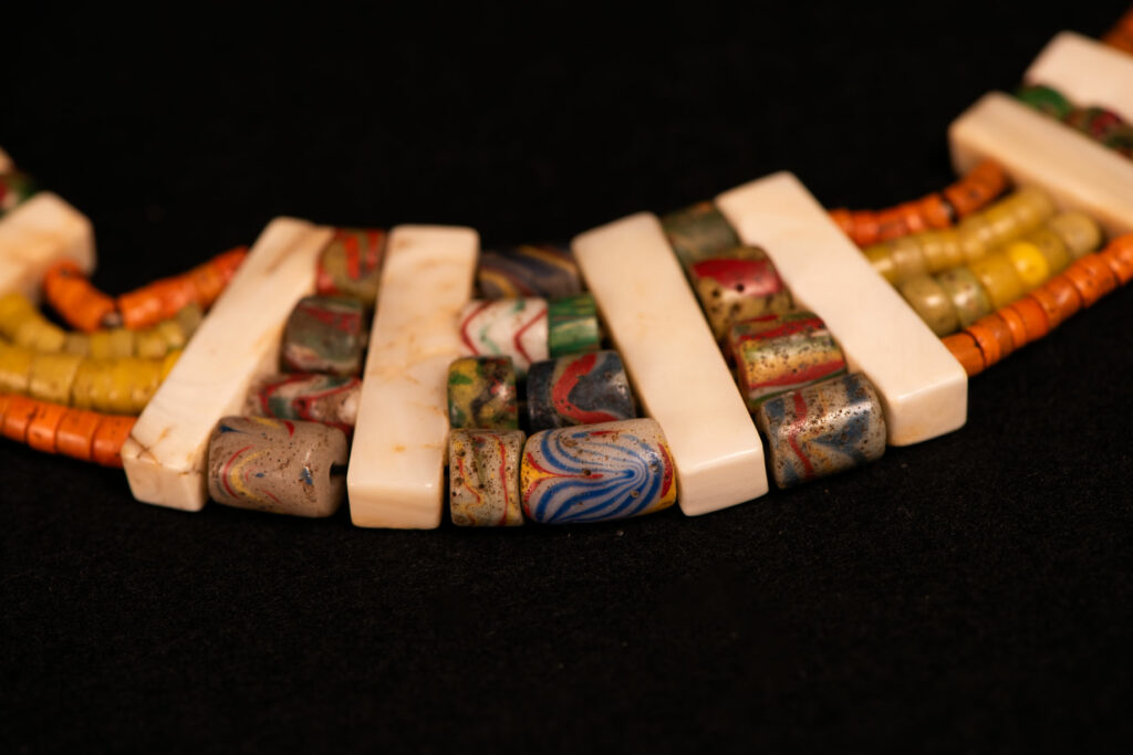 Paiwan tribe old Glass beads collar In Paiwan society, ancient and valuable glass beads are treasured as heirlooms or betrothal gifts, symbolizing aristocratic status. These beads are often carefully stored in old pottery jars.