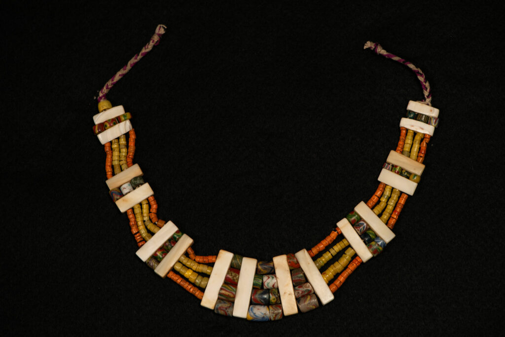 Paiwan tribe old Glass beads collar In Paiwan society, ancient and valuable glass beads are treasured as heirlooms or betrothal gifts, symbolizing aristocratic status. These beads are often carefully stored in old pottery jars.