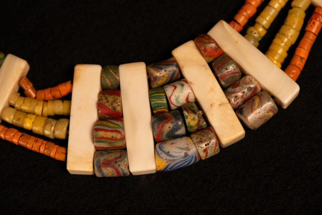 Paiwan tribe old Glass beads collar In Paiwan society, ancient and valuable glass beads are treasured as heirlooms or betrothal gifts, symbolizing aristocratic status. These beads are often carefully stored in old pottery jars.