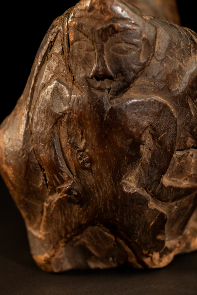 Paiwan tribe archaic ritual cup of a shaman carved with a standing hunter at the front, sacred snakes , deer on the lid and a hunter with his dog hunting a wilde animal .