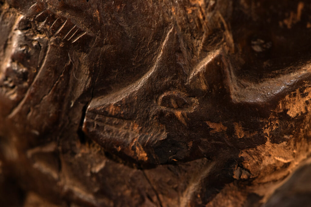 Paiwan tribe archaic ritual cup of a shaman carved with a standing hunter at the front, sacred snakes , deer on the lid and a hunter with his dog hunting a wilde animal