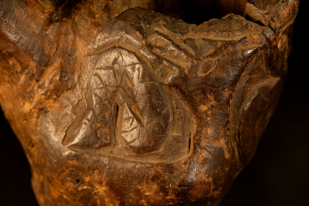 Paiwan tribe archaic ritual cup of a shaman carved with a standing hunter at the front, sacred snakes , deer on the lid and a hunter with his dog hunting a wilde animal