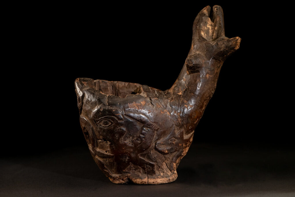 Paiwan tribe archaic ritual cup of a shaman carved with a standing hunter at the front, sacred snakes , deer on the lid and a hunter with his dog hunting a wilde animal