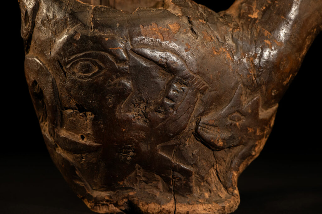Paiwan tribe archaic ritual cup of a shaman carved with a standing hunter at the front, sacred snakes , deer on the lid and a hunter with his dog hunting a wilde animal