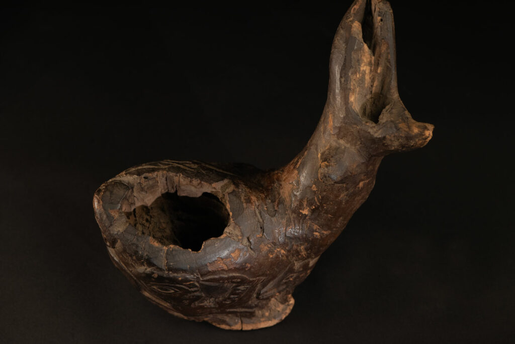 Paiwan tribe archaic ritual cup of a shaman carved with a standing hunter at the front, sacred snakes , deer on the lid and a hunter with his dog hunting a wilde animal