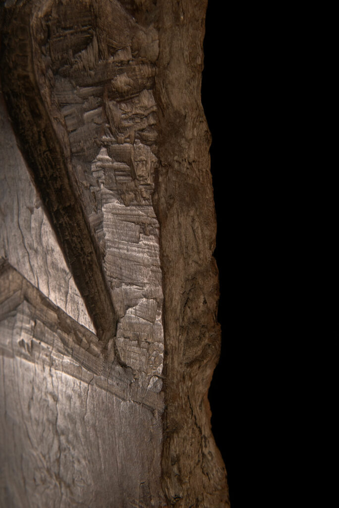 Rare and massive early 19th-century panel from the East Coast Paiwan tribe, carved in the Taimali style. It features a prominent central nose, a stylized face at the top, and another face carved at the bottom — a characteristic design of the Southeastern Paiwan tradition.