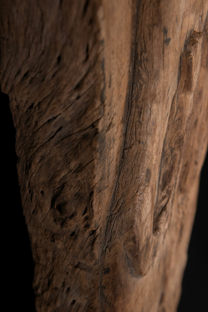 Rare and massive 19th-century Paiwan tribe shamanic ancestor panel, carved with a thick relief depicting a shaman with an oversized head crowned with multiple human faces — symbolizing his responsibility over the tribe’s spiritual and physical well-being.