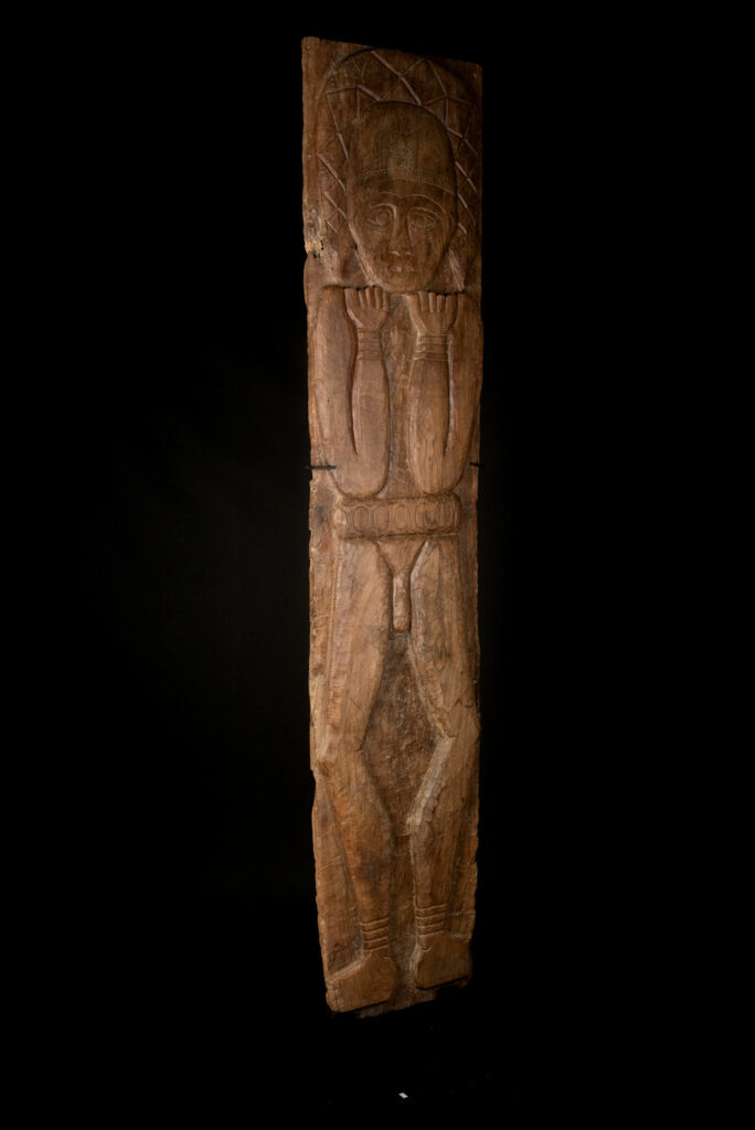 Ancient massive paiwan tribe ancestor panel carved with a standing figure of an ancestor Wearing a two-headed snake as a headdress and a ceremonial belt.