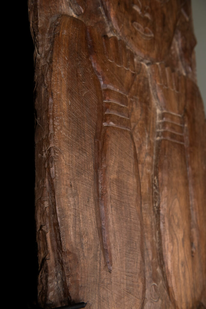 Ancient massive paiwan tribe ancestor panel carved with a standing figure of an ancestor Wearing a two-headed snake as a headdress and a ceremonial belt.