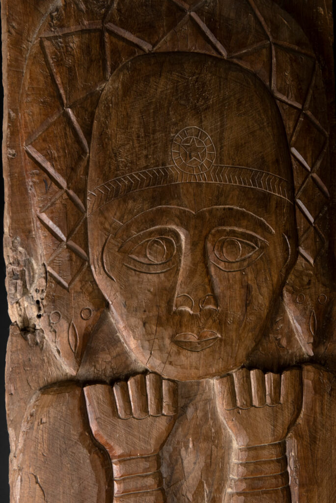 Ancient massive paiwan tribe ancestor panel carved with a standing figure of an ancestor Wearing a two-headed snake as a headdress and a ceremonial belt.