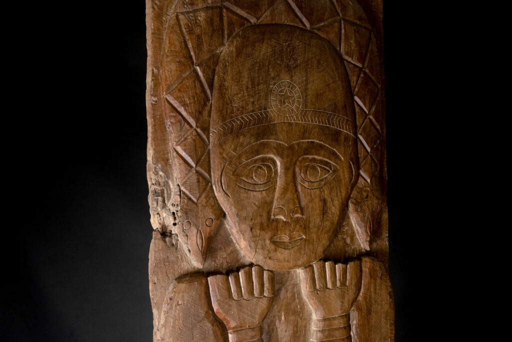 Ancient massive paiwan tribe ancestor panel carved with a standing figure of an ancestor Wearing a two-headed snake as a headdress and a ceremonial belt.