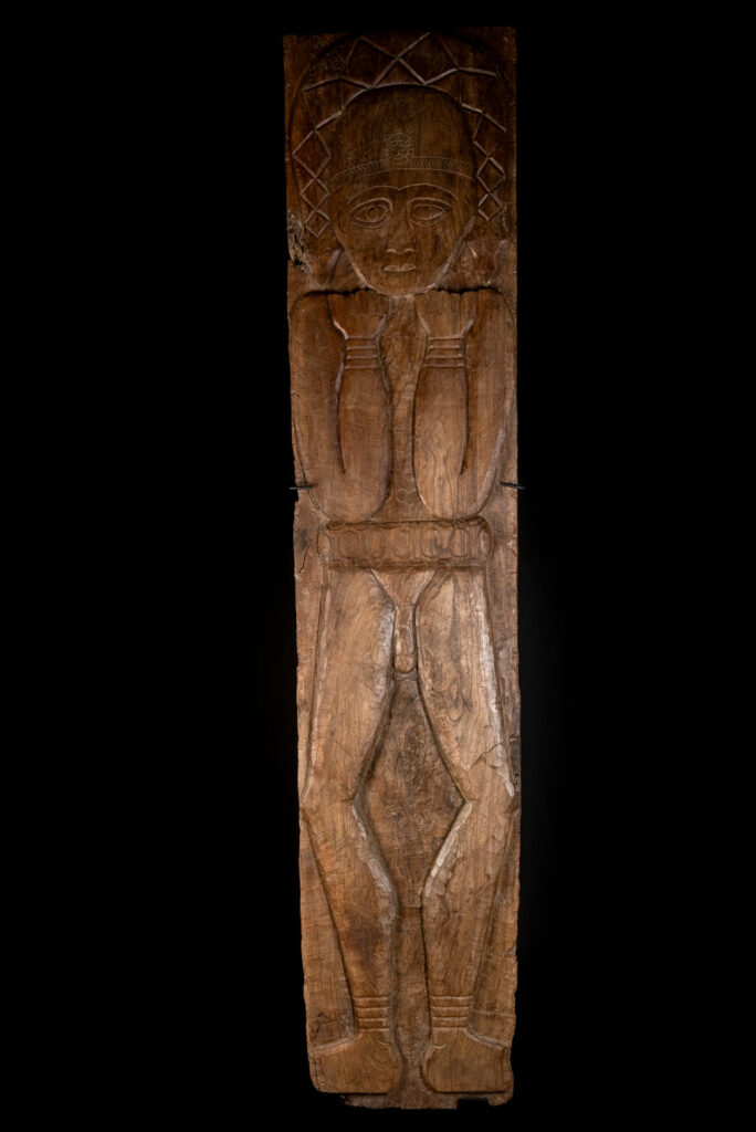 Ancient massive paiwan tribe ancestor panel carved with a standing figure of an ancestor Wearing a two-headed snake as a headdress and a ceremonial belt.
