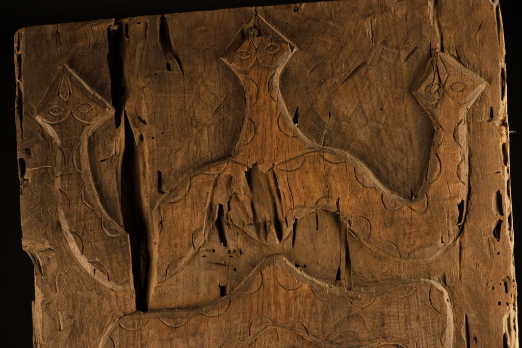 ancient Paiwan tribe panel carved with a standing man, part of a house partition or used as small doors or shutters – South Taiwan