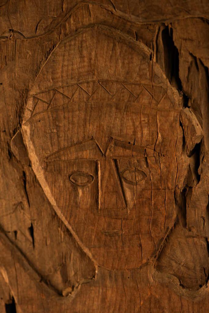 ancient Paiwan tribe panel carved with a standing man, part of a house partition or used as small doors or shutters – South Taiwan