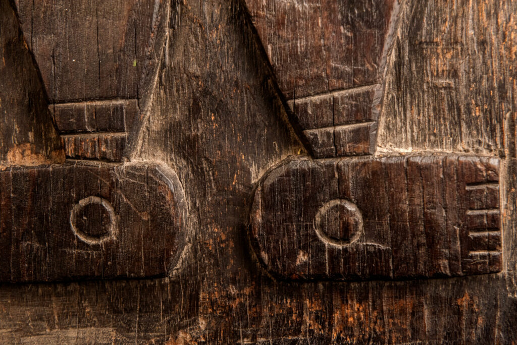 ancient Paiwan tribe panel carved with a standing man, part of a house partition or used as small doors or shutters – South Taiwan