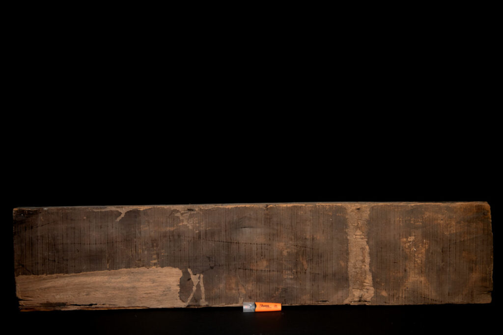 Paiwan tribe house eave carved with warriors drinking millet wine from a double cup — a symbol of unity — after a victory. Taiwan