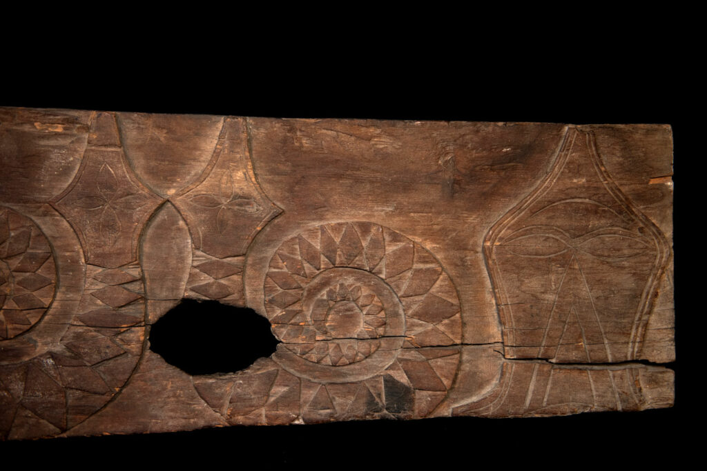 Paiwan tribe house Eave from Majia Township 瑪家鄉 - South Taiwan- Carved with human faces in the Majia style and sacred snakes positioned back to back.